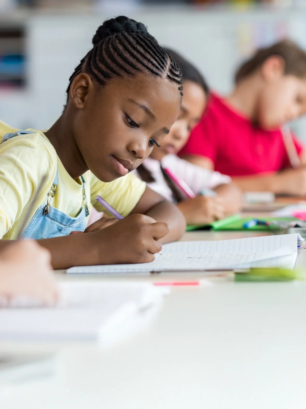 Girl writing on paper