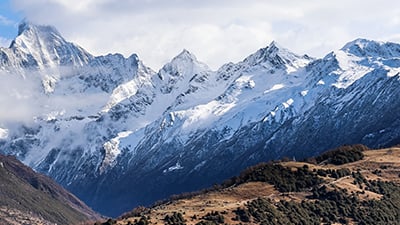 Mountains with four peaks and clouds
